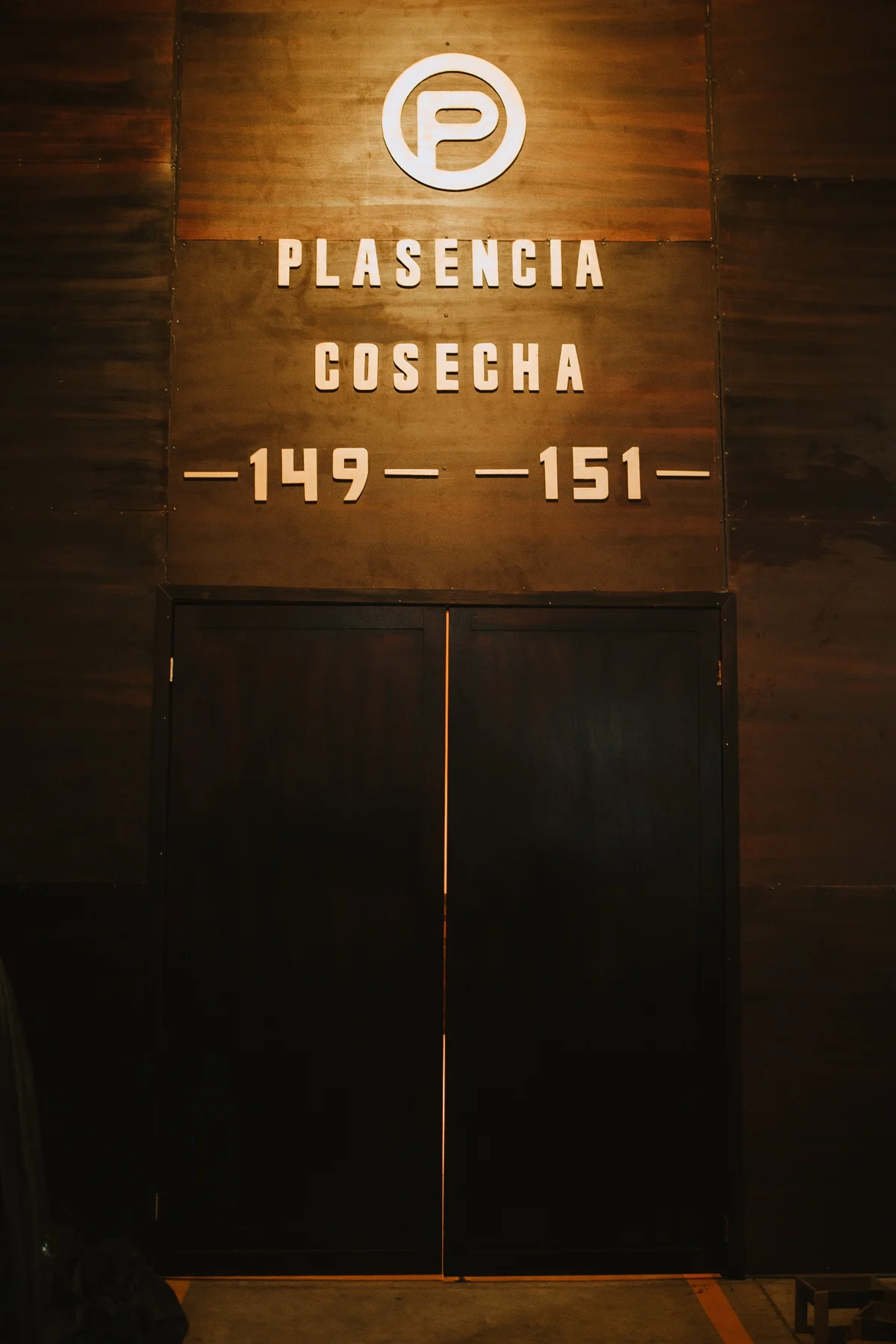 The lit doors of the Plasencia vault, PLASENCIA COSECHA 149 151 lettered above them