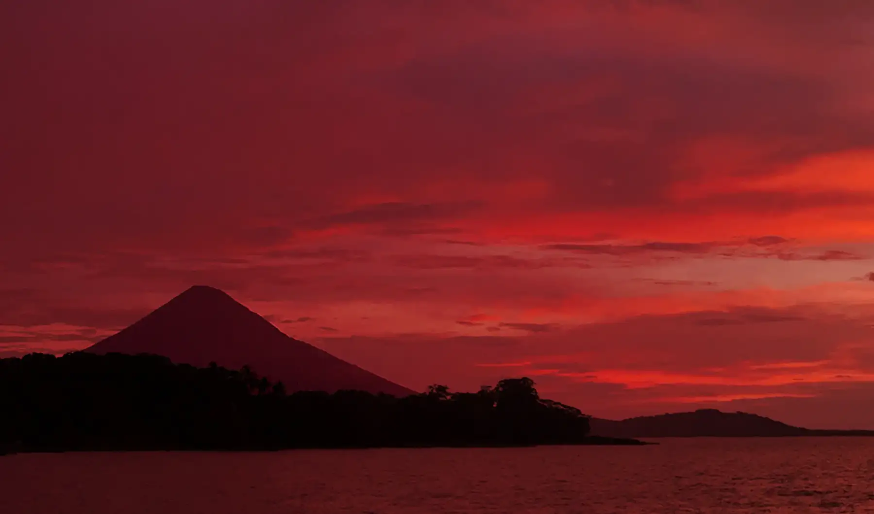 Sunset over Lake Nicaragua, a volcano of the island of Ometepe on the horizon