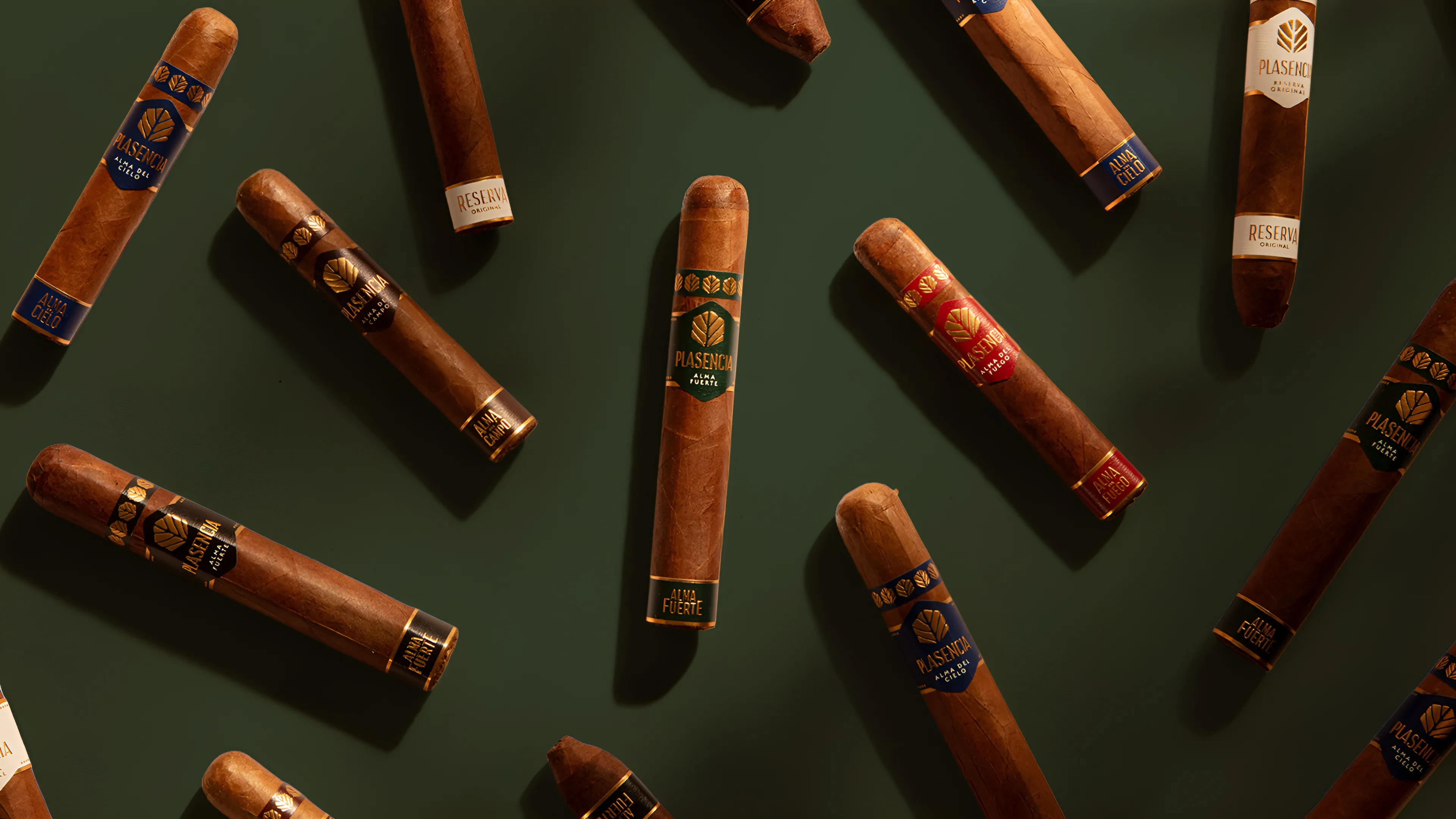 Plasencia singles from every colección laid out on Emerald cloth